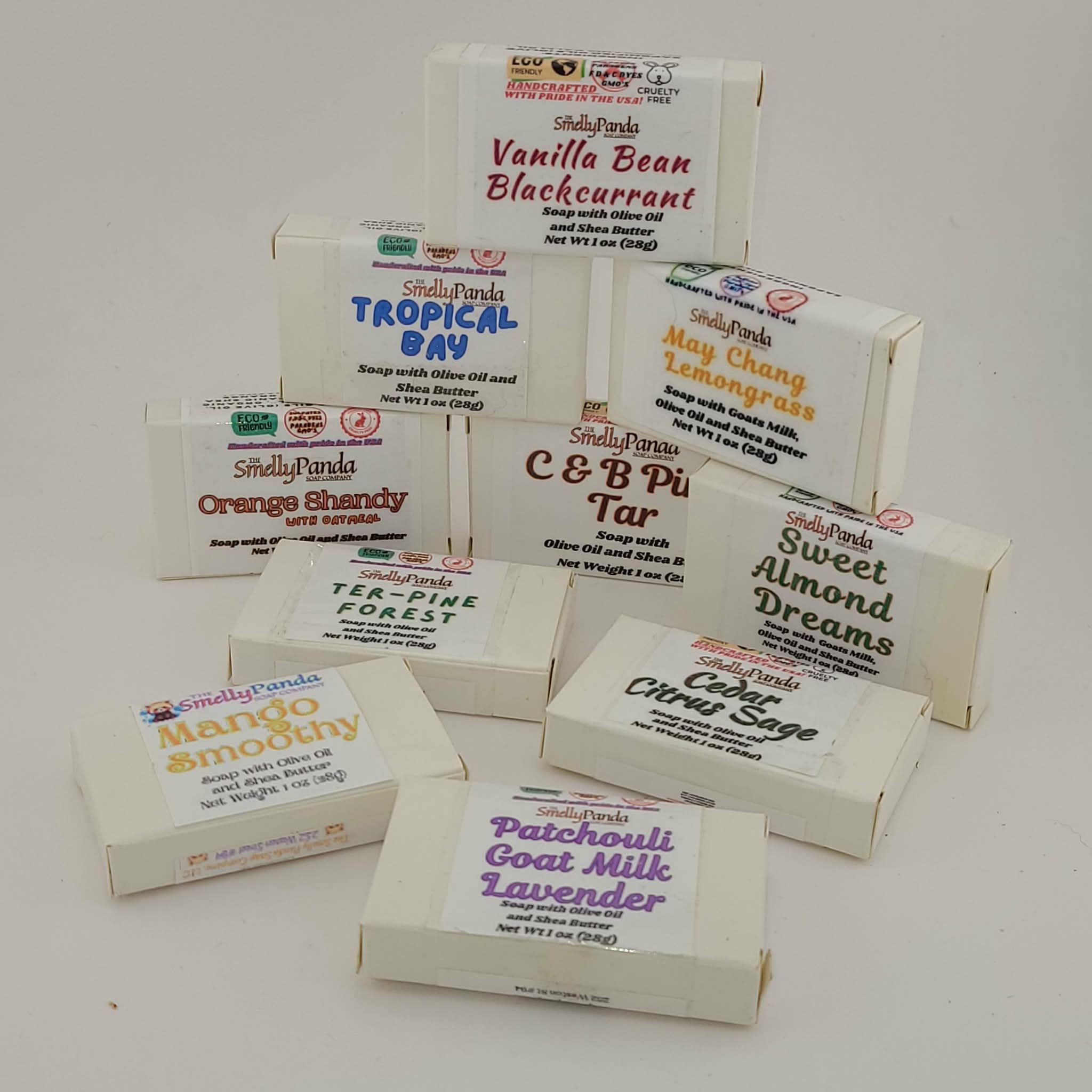Collection of Smelly Panda soap boxes with various scents on a light gray background